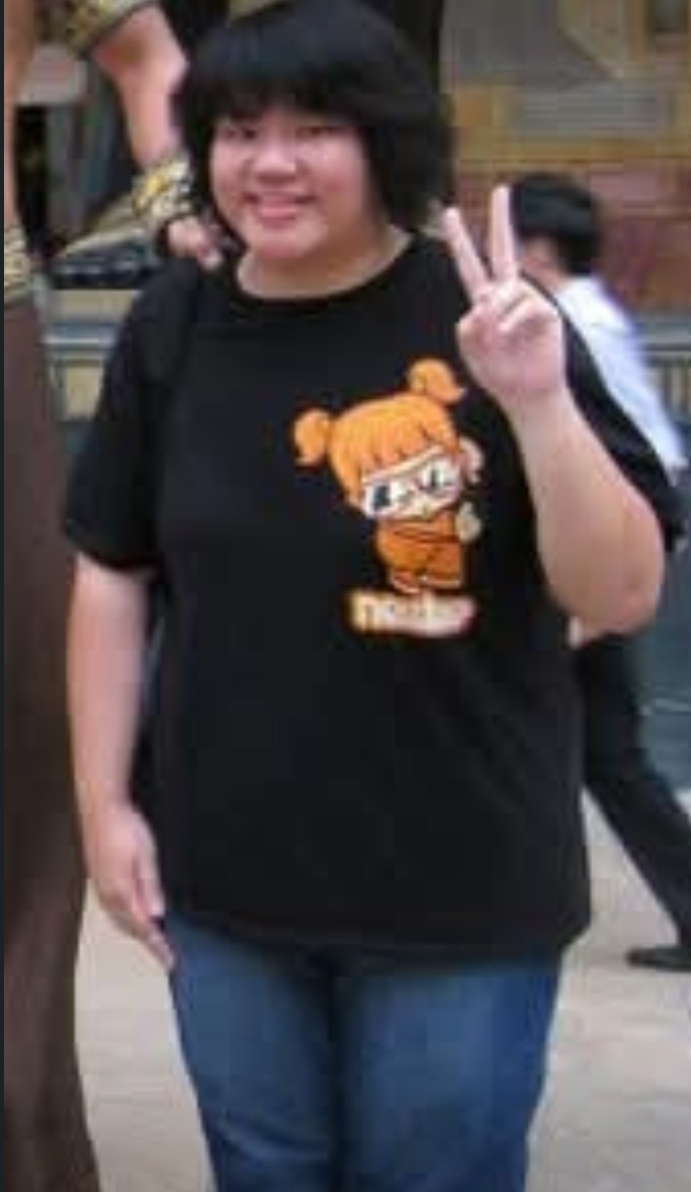An earlier personal photograph of Mabel, smiling and making a peace sign